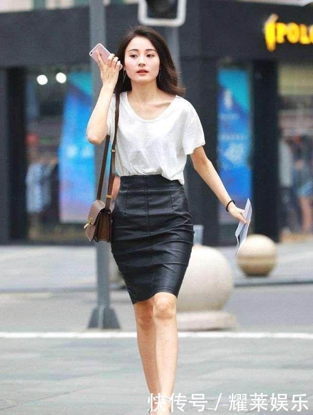 街拍时尚性感白色美女包臀皮裙,上衣气质,散发吻了美女被男人图片