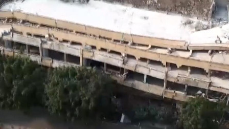 8秒躲过“死神”：男子遇楼房倒塌惊险逃生